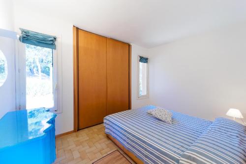 Postel nebo postele na pokoji v ubytování Casa Luisa a Capo d'Arco - Goelba