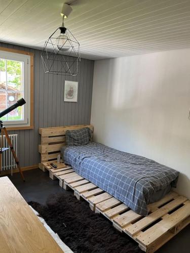 a bedroom with a bed on a wooden platform at Lovely appartment in Rueras bei Sedrun in Rueras