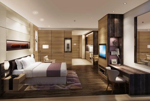 Postel nebo postele na pokoji v ubytování Ascott Central Wuxi