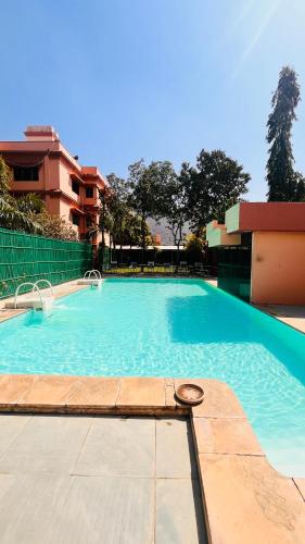 a large blue swimming pool in a building at Hotel Master Paradise, Pushkar, Rajasthan , INDIA in Pushkar