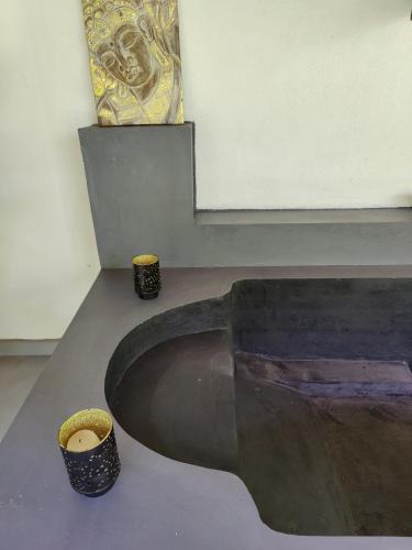 a room with two vases sitting on a table at Villa Lyvie ayurvedic hotel in Tangalle