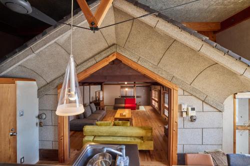 a living room with a couch and a table at 博世庵 in Nishikatsuracho