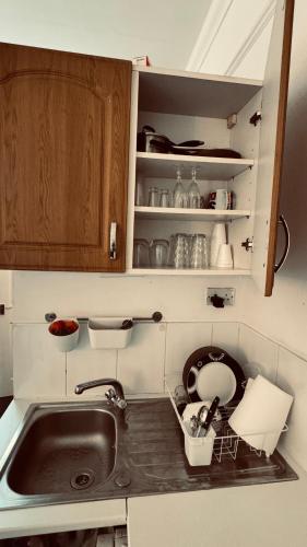 a kitchen counter with a sink and a sink at the quite one in London