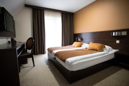 Postel nebo postele na pokoji v ubytování Hotel Mangart