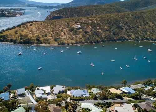 an aerial view of a harbor with boats in the water at Karinya apartment waterfront views - 2 Bed 2 Bath in Lindisfarne
