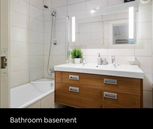 a bathroom with a sink and a bathroom assessment sign at Eget rom og bad med delt kjøkken, 15 minutter fra Trondheim in Malvik