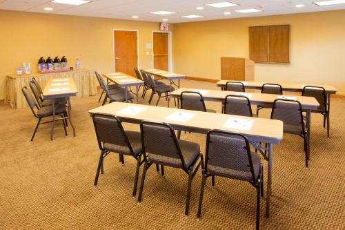 a classroom with tables and chairs in a room at Holiday Inn Express Hotel & Suites Weston by IHG in Weston
