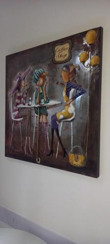 a painting of a group of people in a restaurant at Novecento in Bertinoro