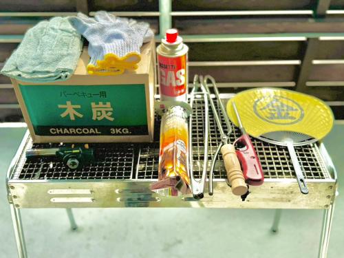 a shopping cart with a box and other items on it at にいのうみ in Tosa