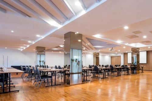 a banquet hall with tables and chairs in it at Eurostars Queen of Montenegro in Budva