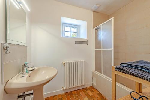 a bathroom with a sink and a shower at Ker Breizh - Saint Pabu - 14 pers in Saint-Pabu