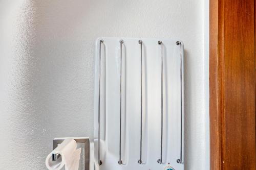 a radiator on a wall with a roll of toilet paper at Storchennest in Ludwigsburg