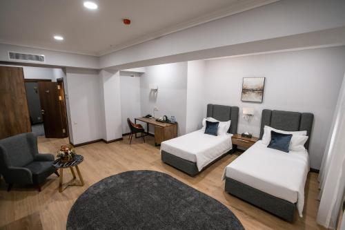 Postel nebo postele na pokoji v ubytování Krokus Plaza