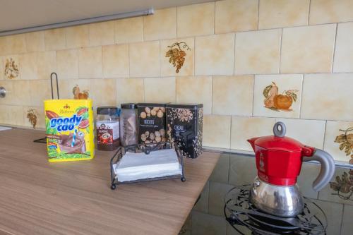 a counter top with a tea kettle and eggs on it at Casa Vacanza Dimora Vincenza in Luino