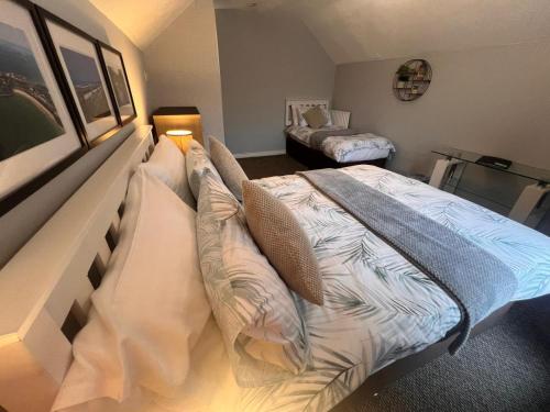 A bed or beds in a room at Rest a While
