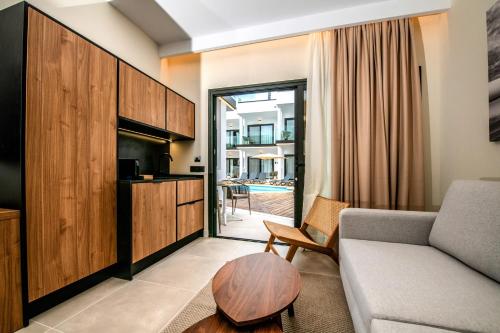 a living room with a couch and a table at Saladar Suites Boutique in Morro del Jable