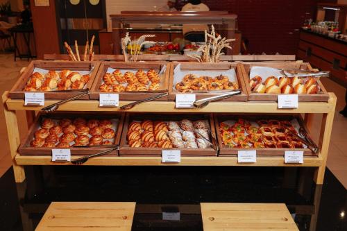 a display case in a store filled with lots of fruit at Holiday Inn Tashkent City by IHG in Tashkent