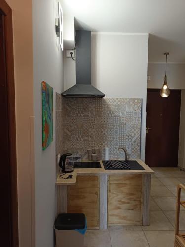 a kitchen with a sink and a stove at Interamna Dreams in Pignataro Interamna