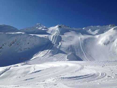 a snow covered mountain with a ski slope at Chalet Rustico Bertolini per Gruppi! in Vermiglio