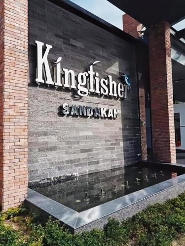 a sign on the side of a building at Kingfisher Sandakan in Sandakan