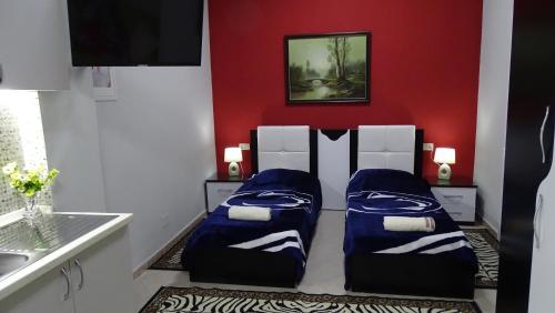 Postel nebo postele na pokoji v ubytování Central Apartments Shoshi