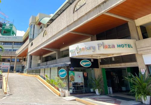 a hotel with a sign on the front of it at Cebu Century Plaza Hotel in Cebu City