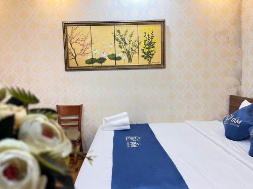 Postel nebo postele na pokoji v ubytování Tấm's House