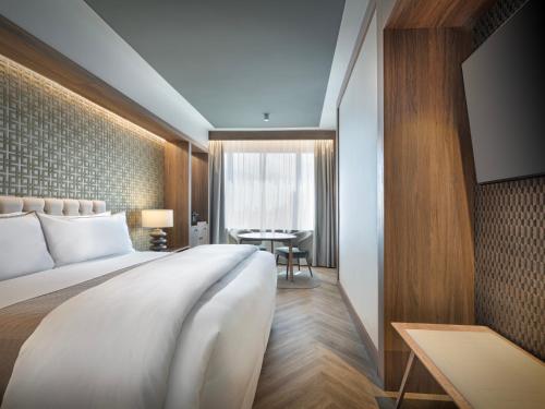 Postel nebo postele na pokoji v ubytování The Westin Madrid Cuzco