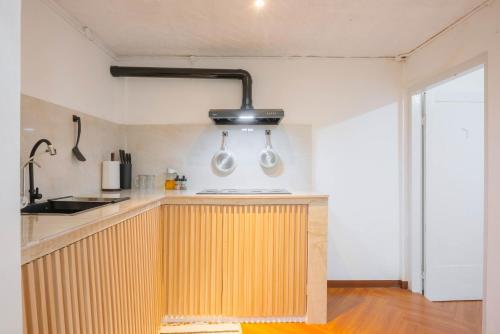 a kitchen with a wooden counter top in a room at CBD Studio3 next to Sun Plaza Real City Center! in Medan