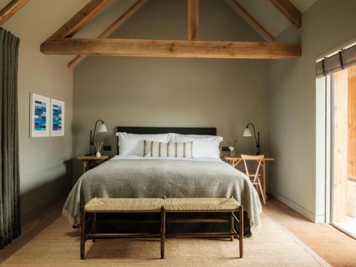 a bedroom with a large bed and a window at The Great Bustard in Durnford