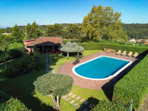 an overhead view of a swimming pool in a yard at Quinta de Santa Luzia in Santo Tirso