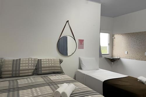 Postel nebo postele na pokoji v ubytování Apartamentos Vitória