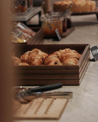 a box of muffins sitting on top of a counter at AMA Stay in San Vigilio Di Marebbe