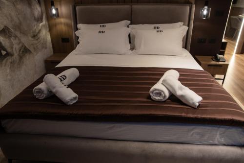 Un ou plusieurs lits dans un hébergement de l'établissement Dial Hotel
