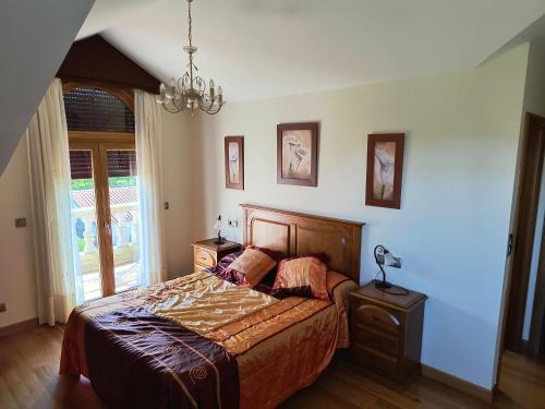 Ένα ή περισσότερα κρεβάτια σε δωμάτιο στο Apartamentos Cruceiro