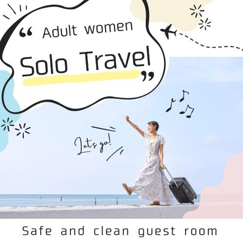 a woman walking on the beach with a suitcase at FarmStayINN 母屋 Sanzaemon-tei GuestHouse Second floor Shiga-Takasima Traditional Japanese architecture house Limited to one group per day in Takashima