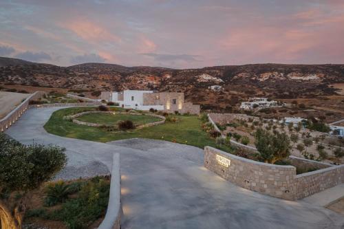 arial view of a road with mountains in the background at Horizon Suites Milos in Paliochori