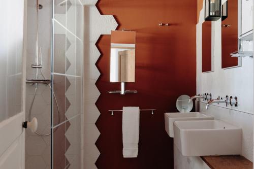 a bathroom with a sink and a toilet at Hôtel Domaine de Biar in Montpellier