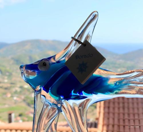 a glass bowl with a fish on top of it at Antares Rooms in Castellabate