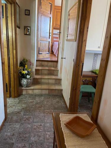 a hallway of a home with stairs and a door at Da Zia Maria in Roccaraso