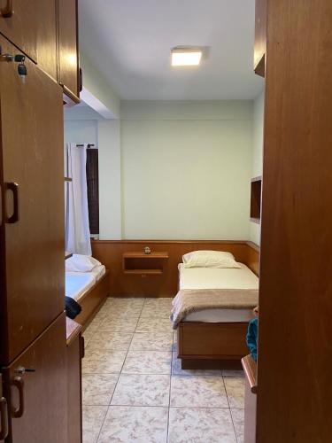 Ένα ή περισσότερα κρεβάτια σε δωμάτιο στο Triana Guest House