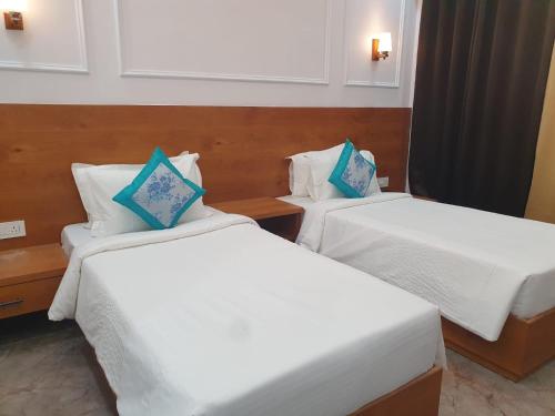 Postel nebo postele na pokoji v ubytování The Ashoka Hotels & Resorts, Panna
