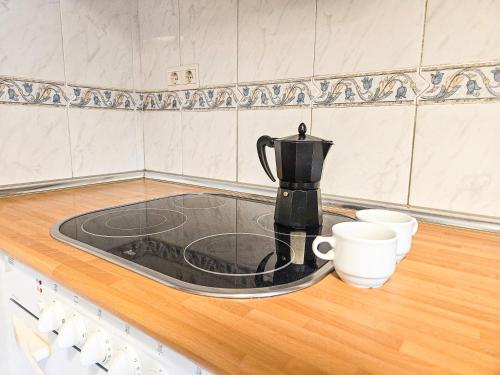 Příslušenství pro přípravu čaje a kávy v ubytování Apartamentos Casa Boira 3000