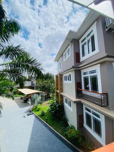 an image of a house with a swimming pool at Jacomo Residences in Dar es Salaam