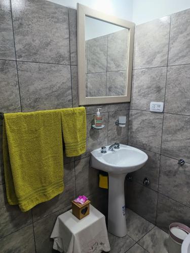 a bathroom with a sink and a mirror at Casa Alma San Pedro in San Pedro