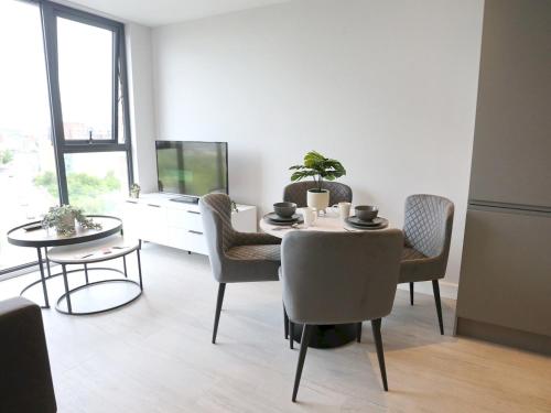a dining room with a table and chairs at Regent Road - 9th Floor, Pets Allowed, 24hr Shop - Pass the Keys in Manchester