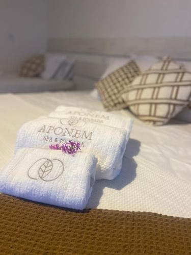 Postel nebo postele na pokoji v ubytování Aponem Spa & Pousada