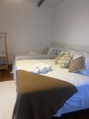 Postel nebo postele na pokoji v ubytování Aponem Spa & Pousada
