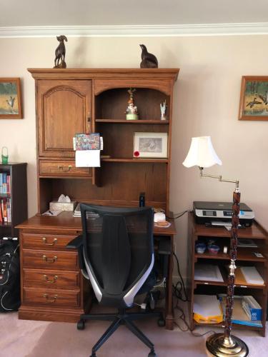 an office with a desk and a chair in a room at Cliff’s Place in Iron Bridge