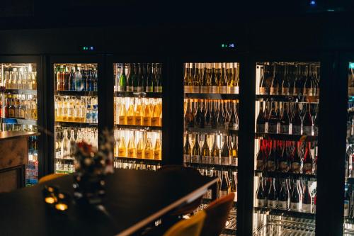a room filled with lots of bottles of wine at Biologen Herdla in Askøy